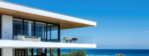 a dynamic urban scene depicting a skilled roofing contractor expertly installing sleek, modern roofing materials on a contemporary beachfront property under the clear blue sky of pompano beach.